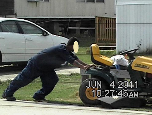 Person Pushing a Large Lawnmower