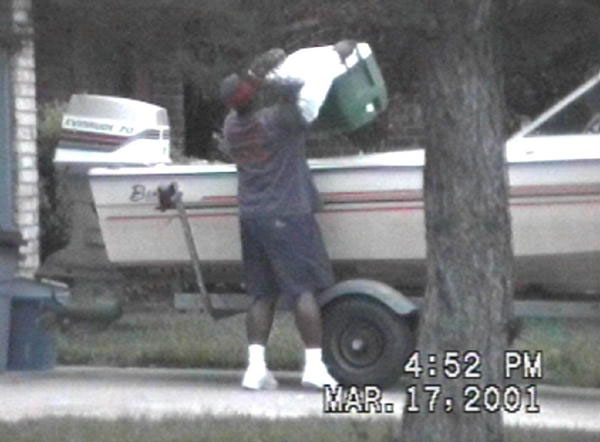 Person Carrying a Cooler Out of the Boat